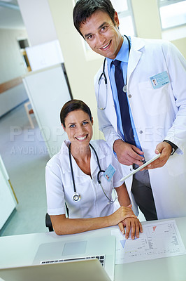 Buy stock photo Portrait of a smiling medical team going through case files