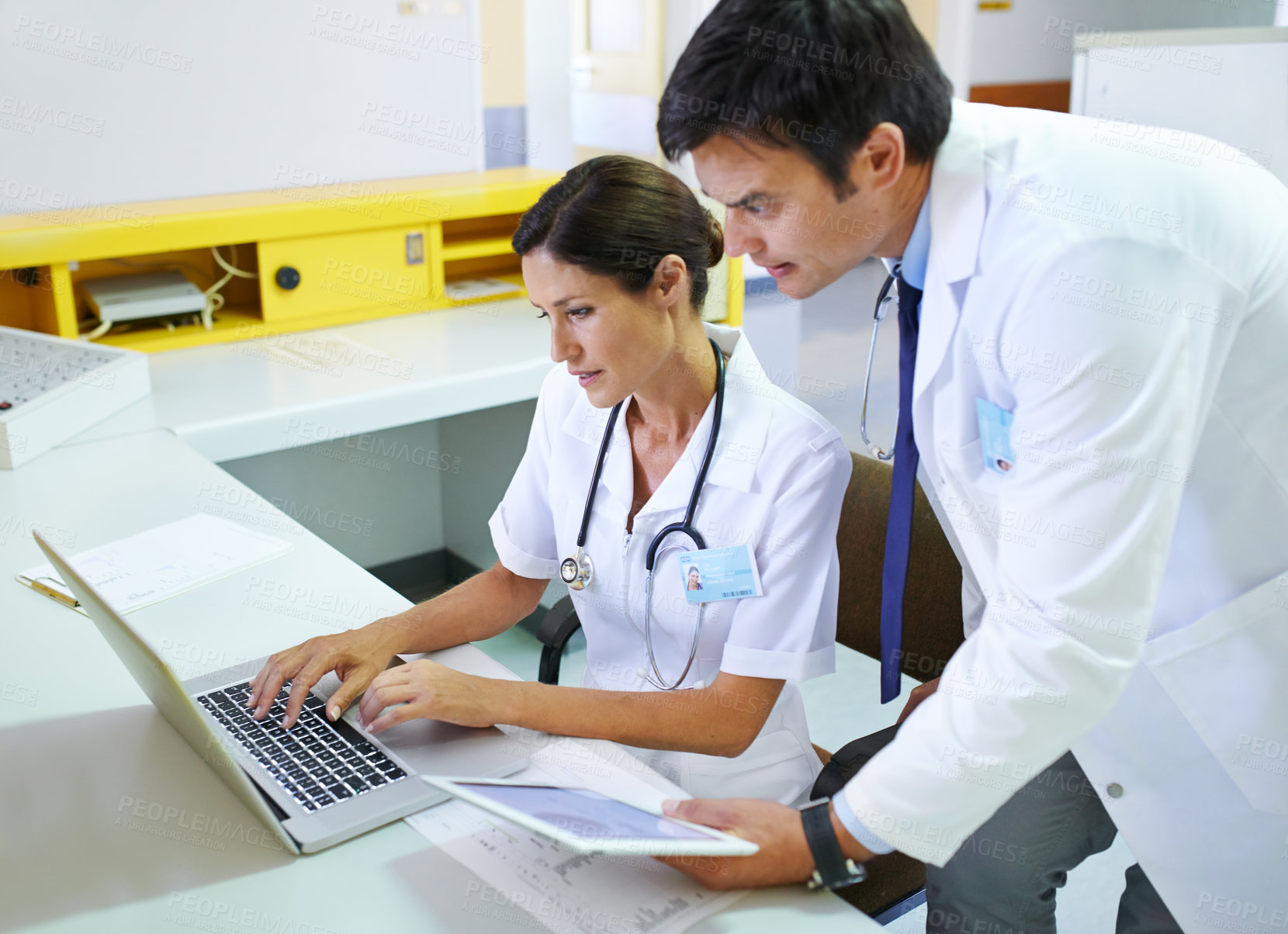 Buy stock photo Shot of a medical team doing research online