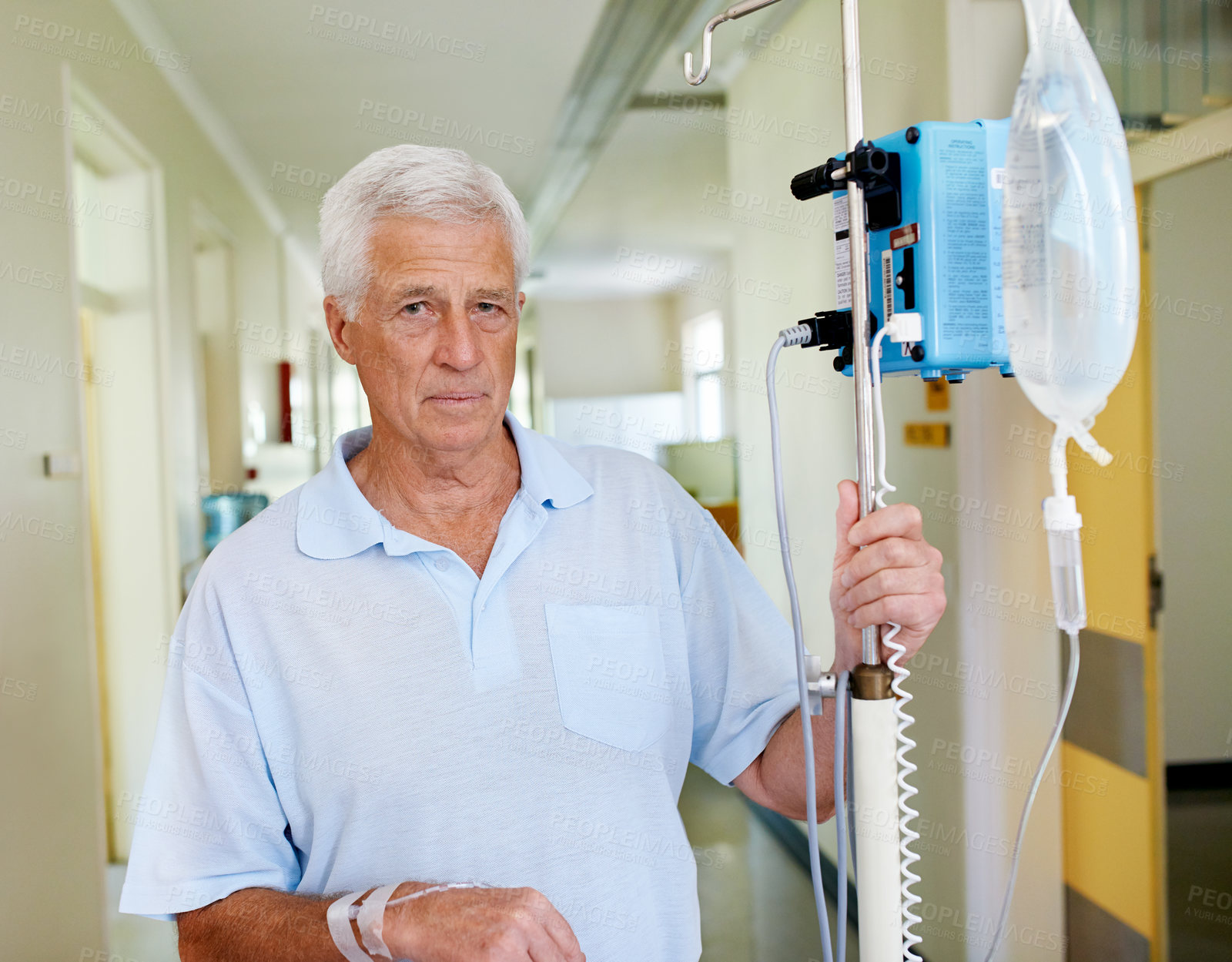 Buy stock photo Portrait, IV drip and old man in hospital, patient and sad for illness on hallway, healthcare and wellness. Serious, sick and equipment for hydration of elderly person, nutrition and cure in clinic