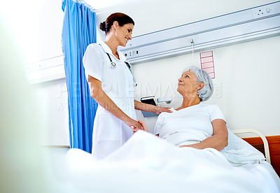 Buy stock photo Hospital room, compassion and care of nurse, old woman and communication for health of patient and medical. Clinic, wellness and employee with senior person, holding hands and smile in appointment