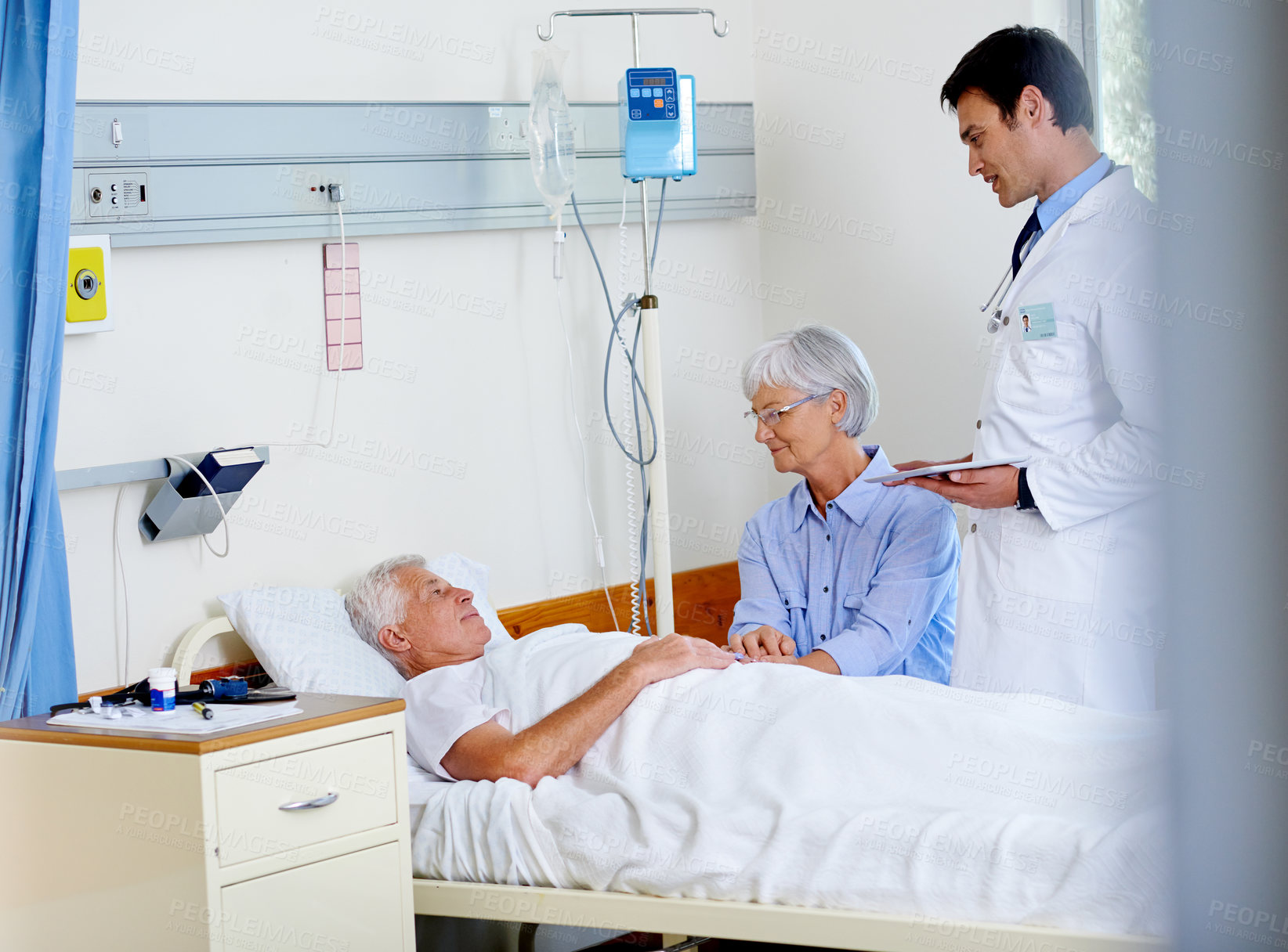 Buy stock photo Patient, doctor and woman on bed in clinic, medical professional and diagnosis with tablet for senior man. People, support and love for visiting or healthcare, hospitalized and illness treatment