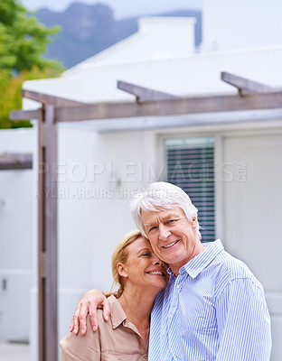 Buy stock photo Portrait of an elderly couple standing in front of their house