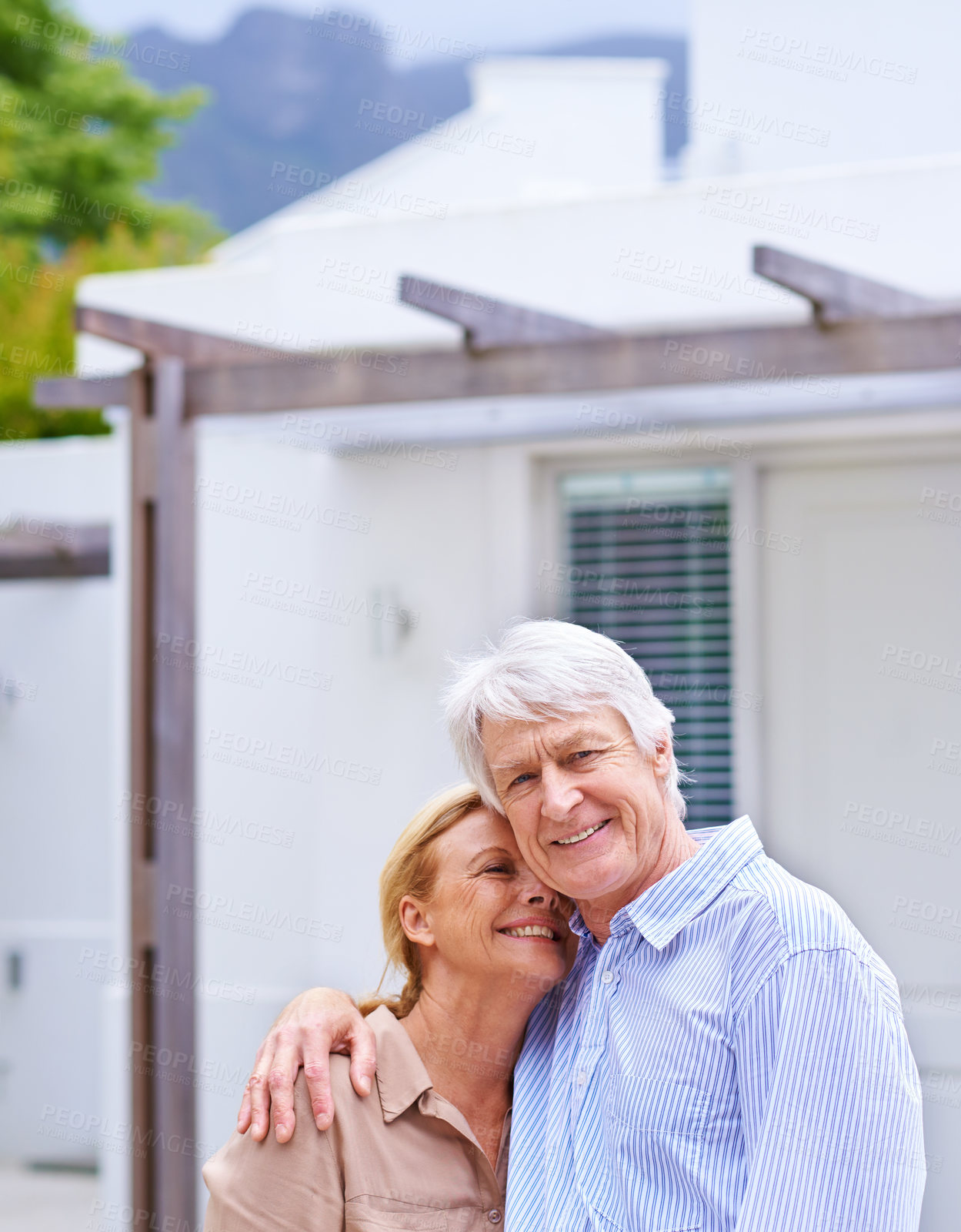 Buy stock photo Senior couple, hug and real estate outdoor for investment, mortgage or loan for new home dream. Retirement, man and happy woman by property sale for moving, relocation and insurance with homeowners