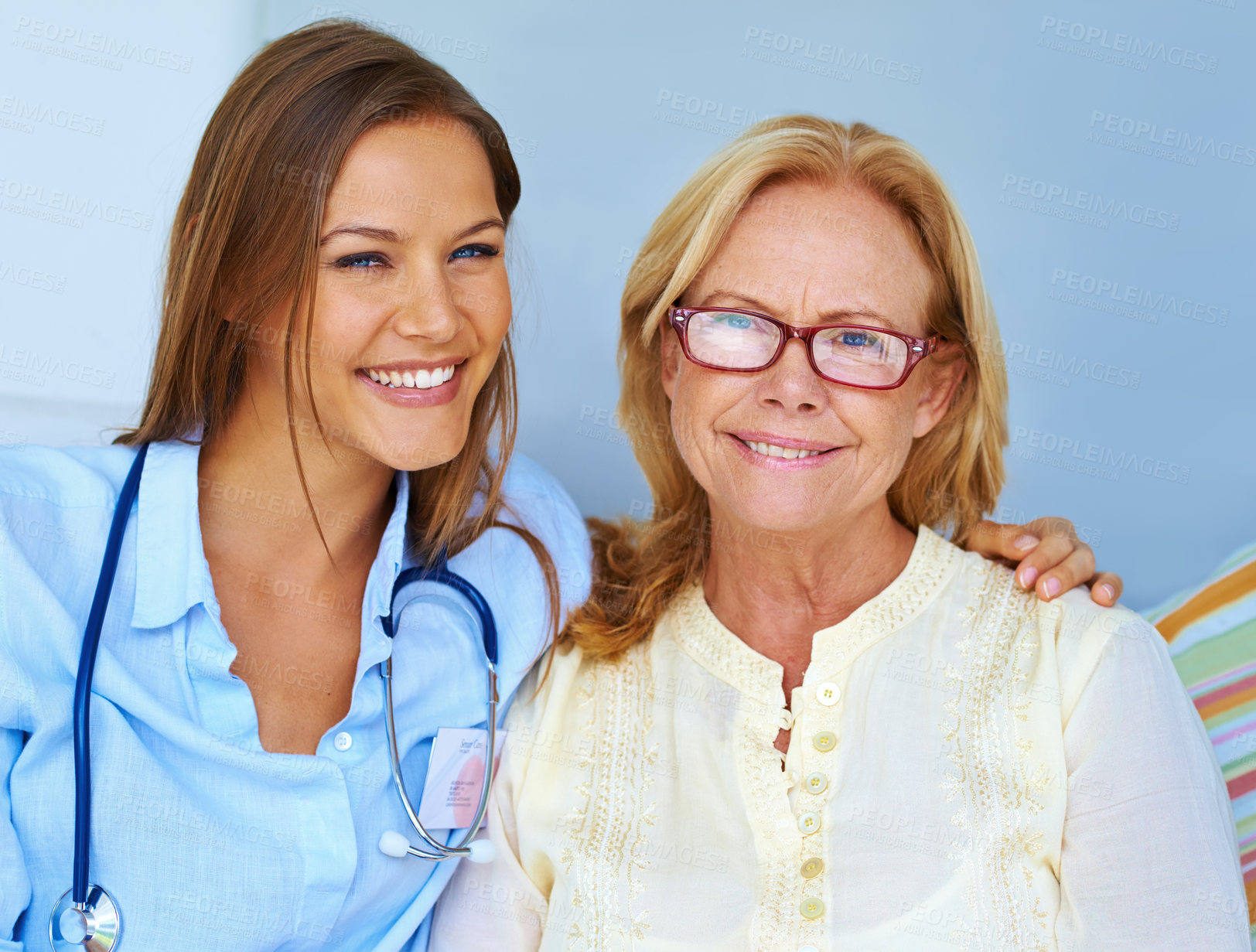 Buy stock photo Elderly care, people and portrait in nursing home with smile, support and medical expertise. Senior woman, nurse and happy on sofa for healthcare, retirement and hug for assisted living in Canada