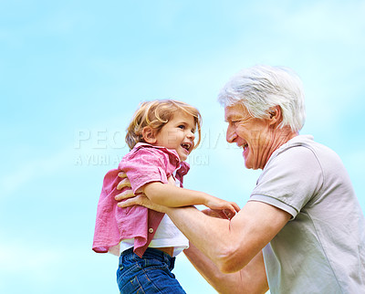 Buy stock photo Happy, lifting and smile with grandfather and grandson for bonding, affectionate and free time. Happiness, fun and playing with old man and boy for family generations on blue sky mockup with space