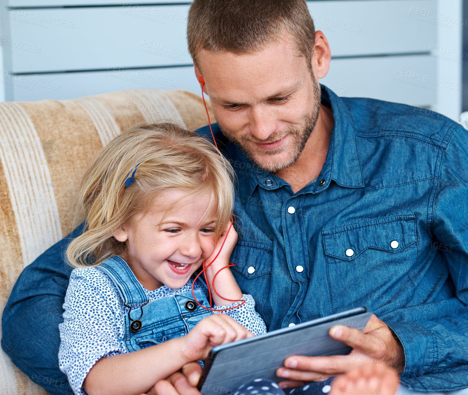 Buy stock photo Man, happy and child on couch with tablet, ebook and media or movies on porch. Earphones, family and streaming in home or lounge for video, meme and listening with online and games for mobile app