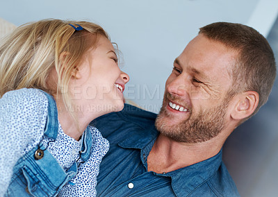 Buy stock photo Shot of an adorable little girl laughing with her father