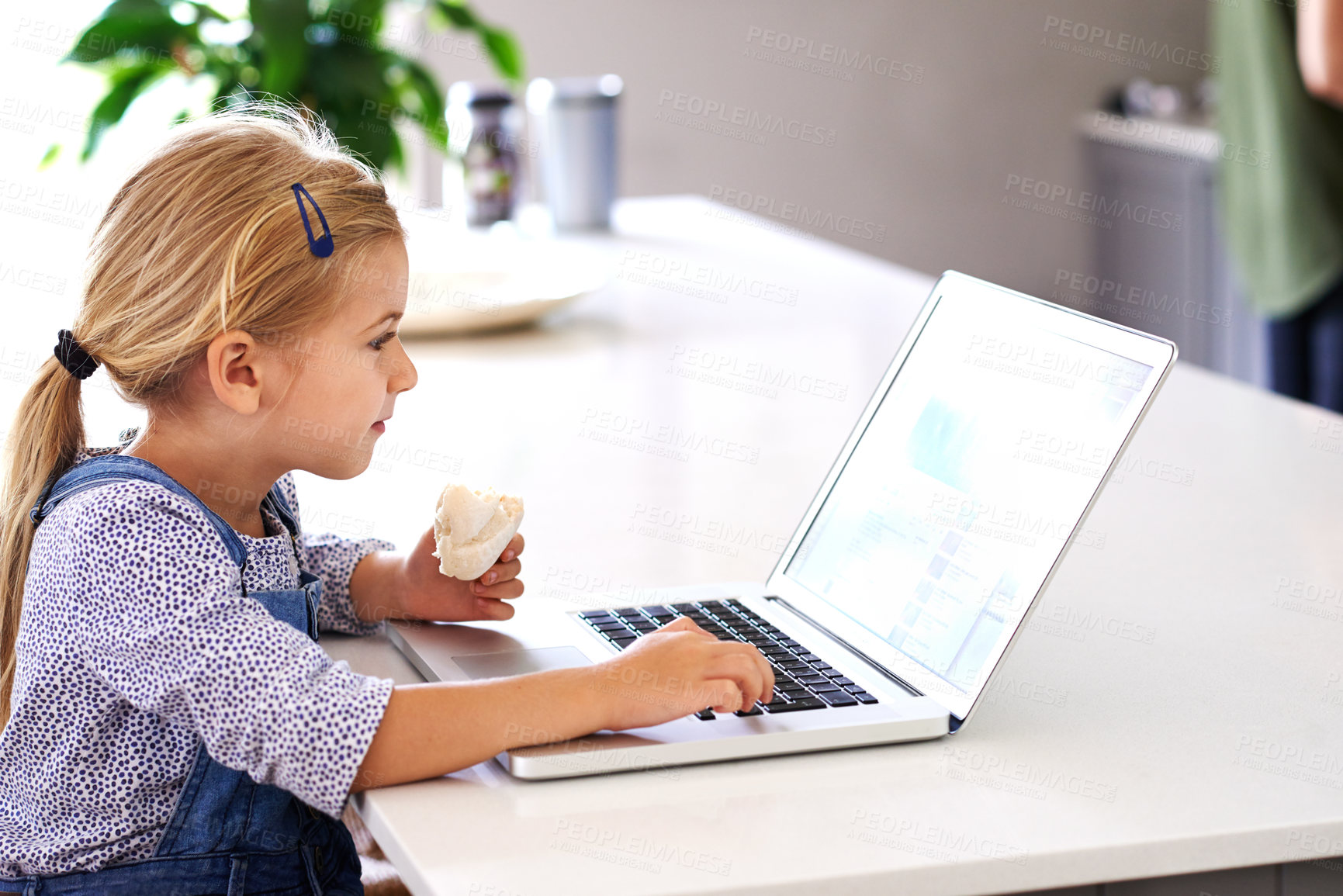 Buy stock photo Child, laptop and reading in kitchen for education, online and internet for e learning at table. Kid, snack and screen or social media in home for streaming, digital app and website for communication