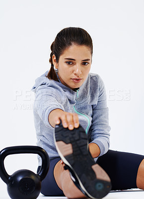 Buy stock photo Studio, kettlebell and exercise of woman, stretching and thinking of training for strength or sporty. White background, space and confident with equipment for fitness, healthy and wellness for person