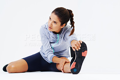 Buy stock photo Studio shot of an attractive young woman working out