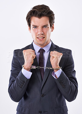 Buy stock photo Businessman, portrait and handcuffs with fraud for crime or company scheme in studio on a white background. Frustrated man or employee in arrest or restraint for embezzelment, lawsuit or bankruptcy