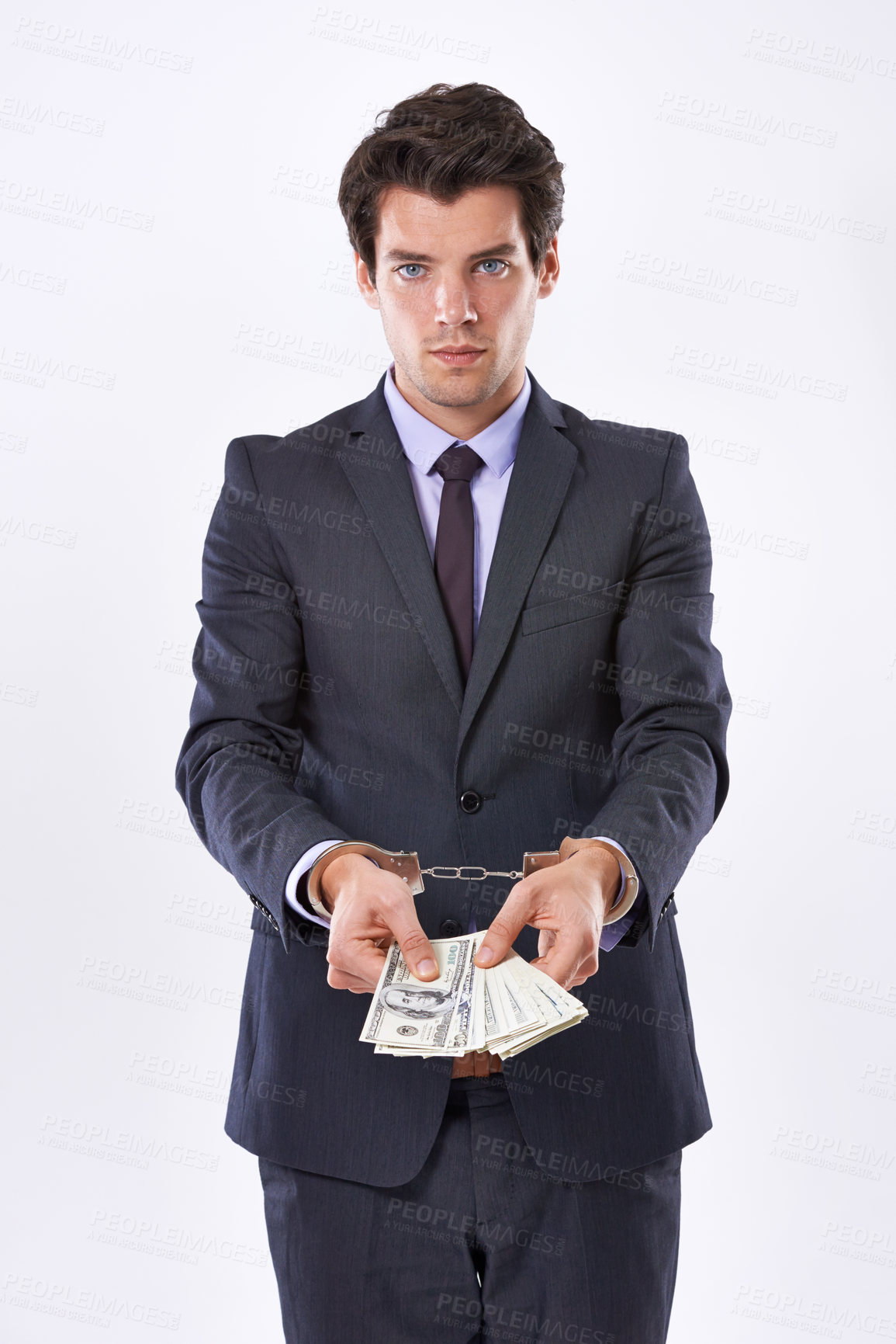 Buy stock photo Handcuffs, cash and portrait of businessman with dollars for fraud, bribery or money laundering. Law, financial crime and punishment of criminal with stealing, corruption and scam on white background