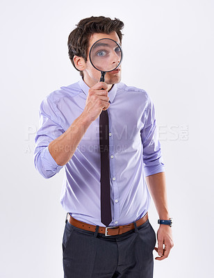 Buy stock photo Portrait, face and business man with magnifying glass, investigator and audit at company on white studio background. Eye, male employee and PI with compliance and fair trade evidence or information