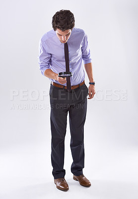 Buy stock photo  Businessman, investigate or magnifying glass to search in studio for quality inspection, compliance or check. White background, inspector or auditor looking down with attention or curiosity for clue