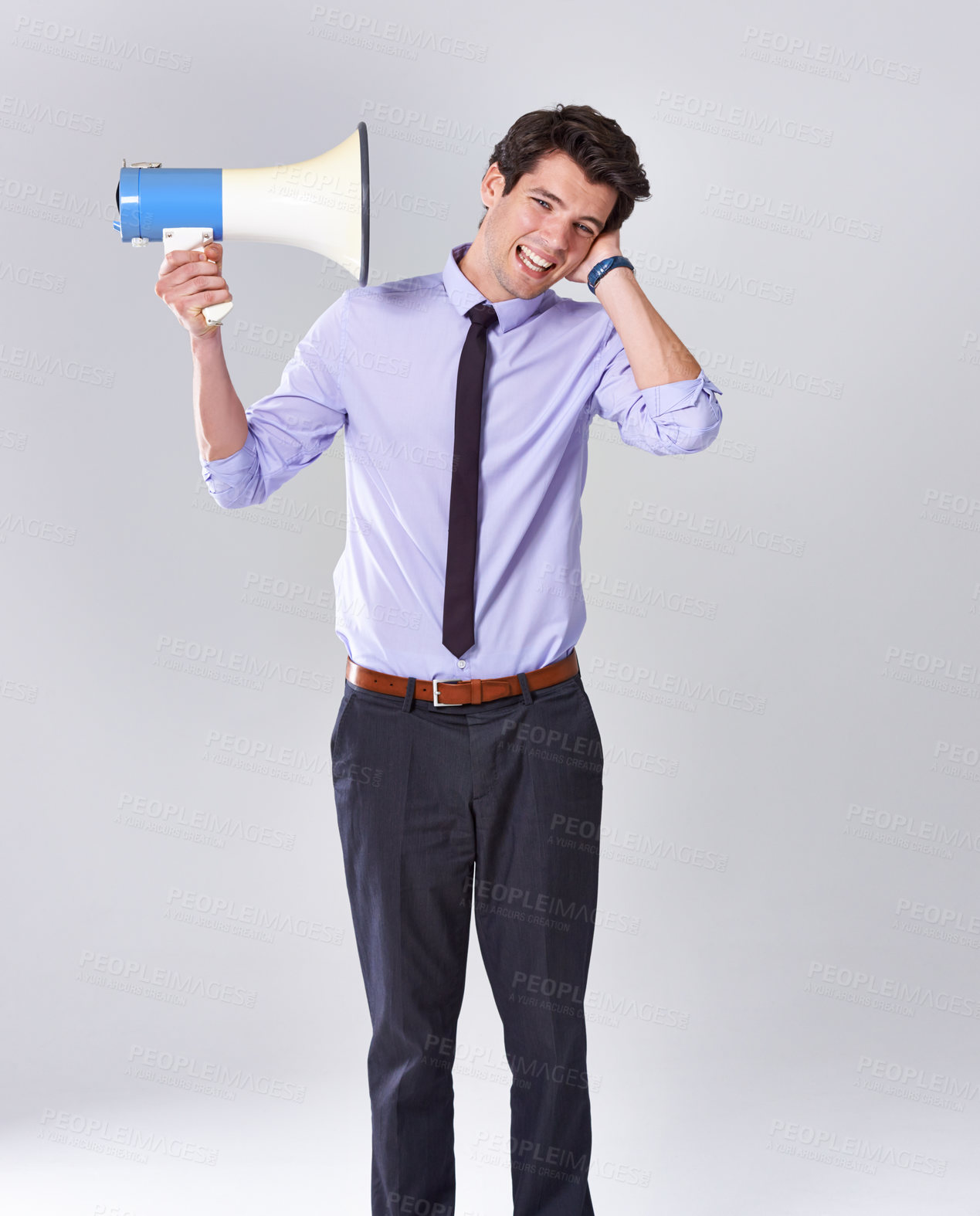 Buy stock photo Business man, noise and megaphone by ear in studio for communication, announcement or breaking news. Employee, loud and loudspeaker on white background for broadcast, warning and corporate propaganda