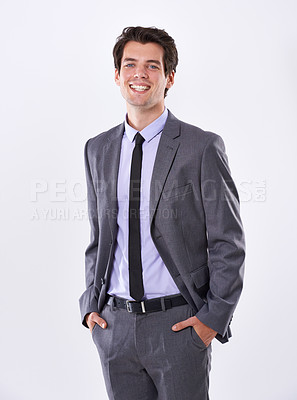 Buy stock photo Business man, smile and hands in pocket for confidence, pride and professional on white background. Corporate lawyer, portrait and cool in studio with suit, success and happiness for career ambition