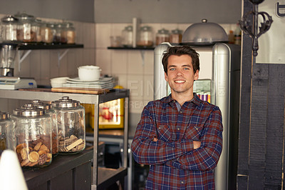 Buy stock photo Portrait, happy and man in cafe with confidence, cookies or professional in service industry. Smile, waiter or arms crossed at counter for hospitality, customer care or small business bakery in Spain