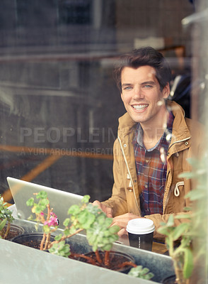 Buy stock photo Man, portrait and laptop with smile in coffee shop for remote work, typing or research in morning. Person, journalist or writer with computer, happy or editing process by window for article in cafe