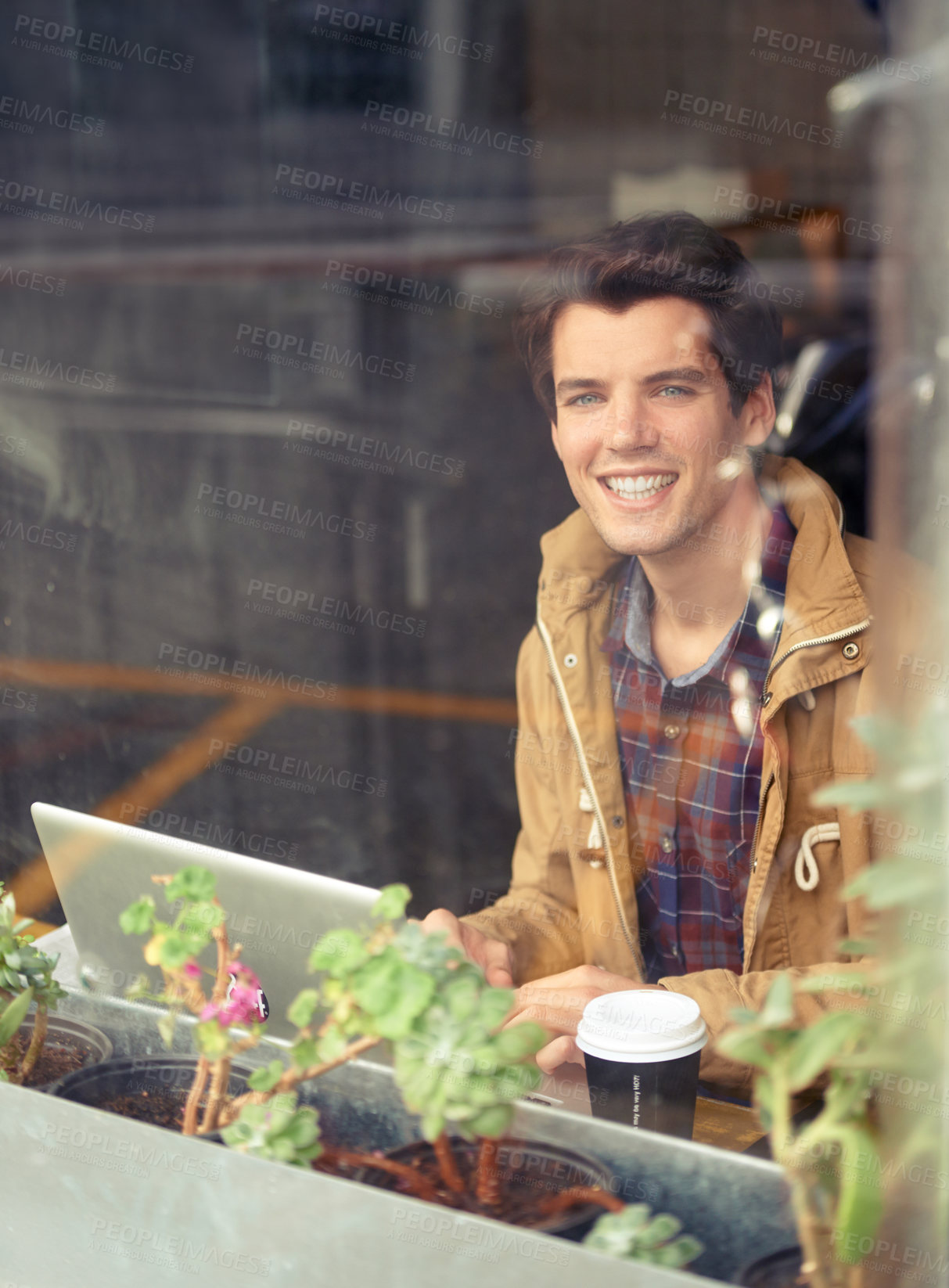 Buy stock photo Man, portrait and laptop with smile in coffee shop for remote work, typing or research in morning. Person, journalist or writer with computer, happy or editing process by window for article in cafe