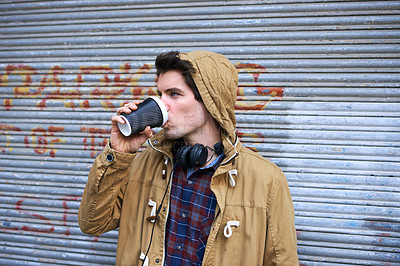 Buy stock photo Man, drink and coffee outdoor for travel, relax and lunch break with headphones, hoodie or takeaway. Male person, peace and latte outside for winter, tourism and warm beverage in morning in New York