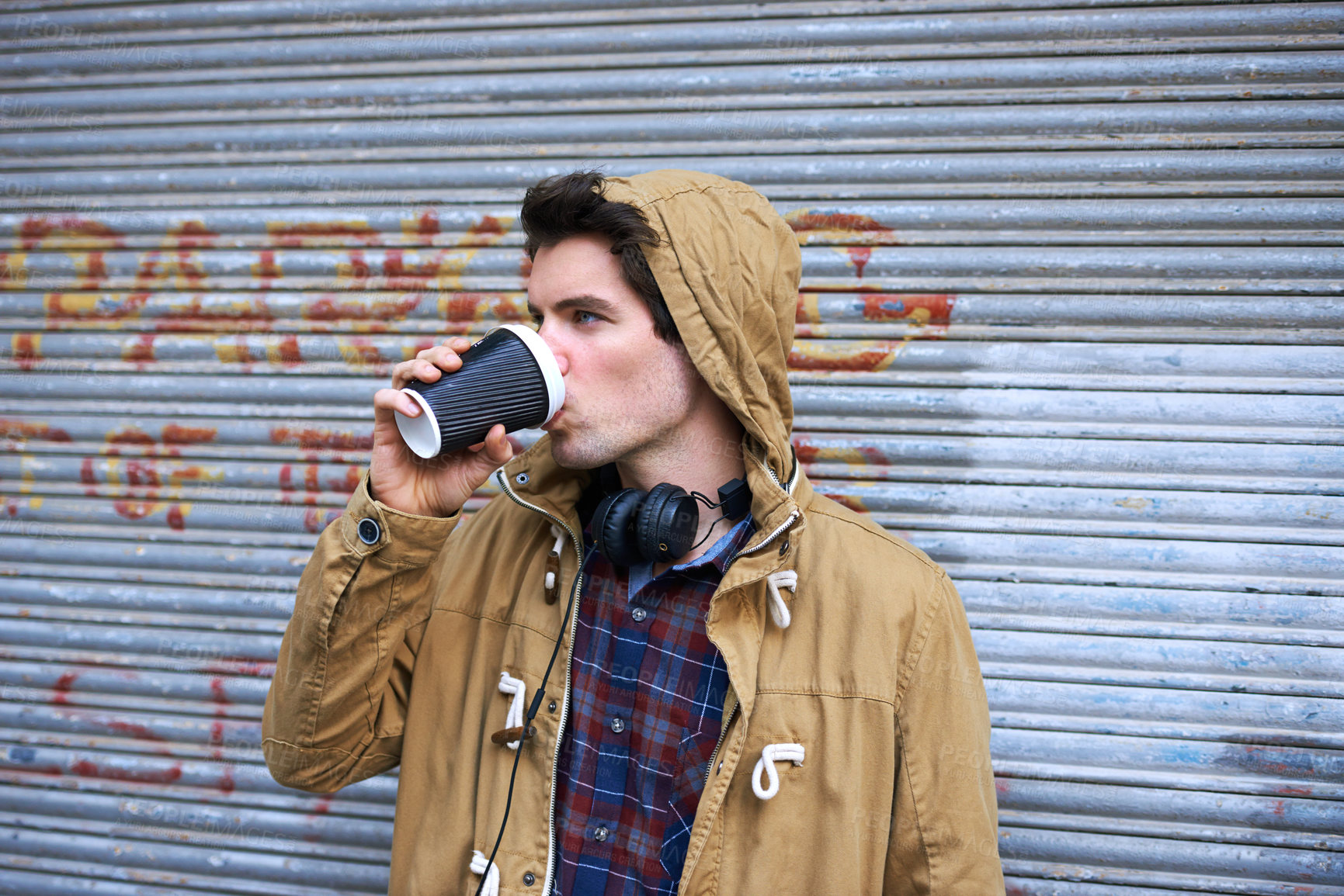 Buy stock photo Man, drink and coffee outdoor for travel, relax and lunch break with headphones, hoodie or takeaway. Male person, peace and latte outside for winter, tourism and warm beverage in morning in New York