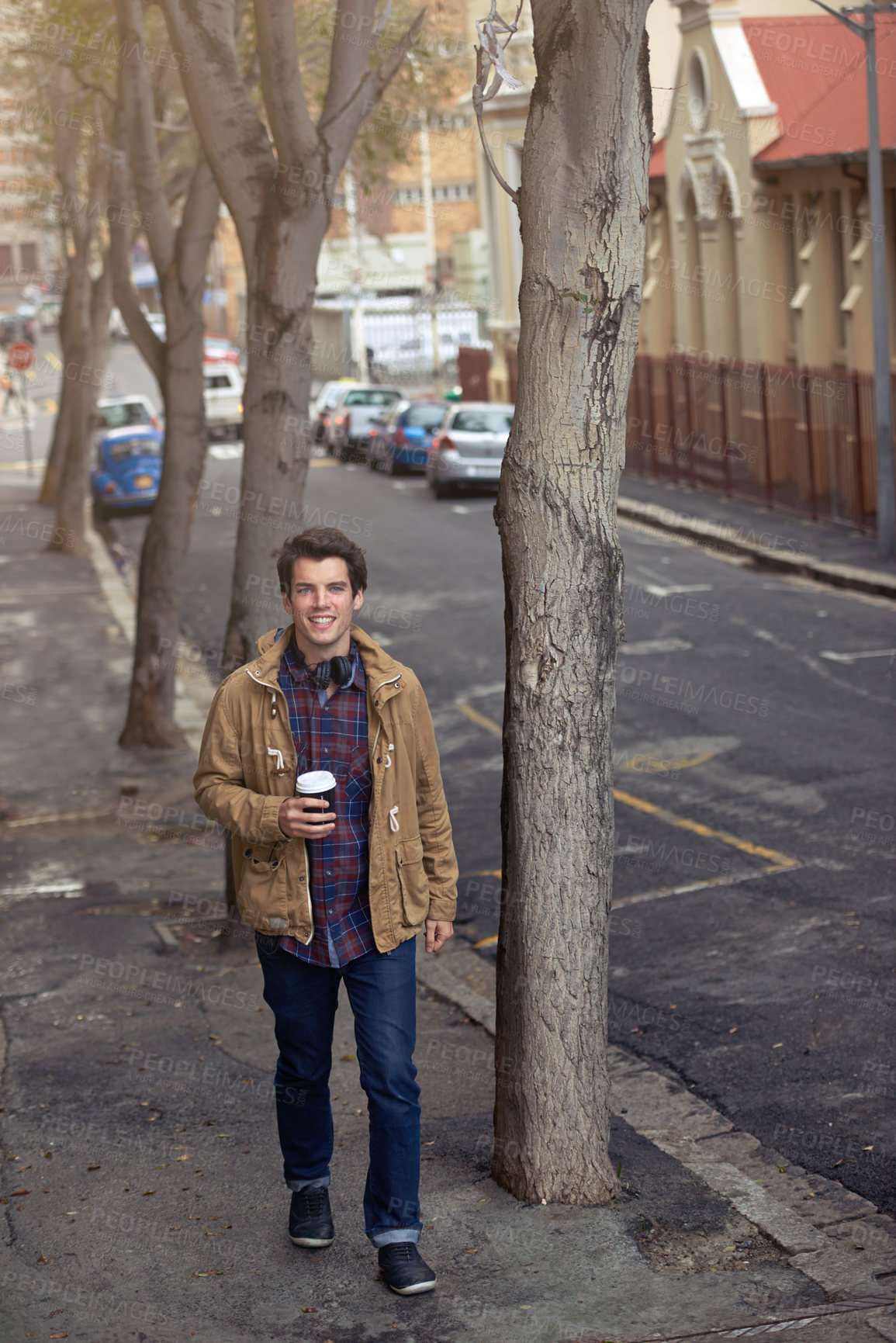 Buy stock photo Fashion, headphones and portrait of man, walking and commuting in morning, happy and confident on street. Coffee, outdoor and winter clothes for person, chilling and joy in New York, cool and stylish