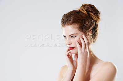 Buy stock photo Cropped studio shot of a gorgeous young woman with bare shoulders isolated on gray