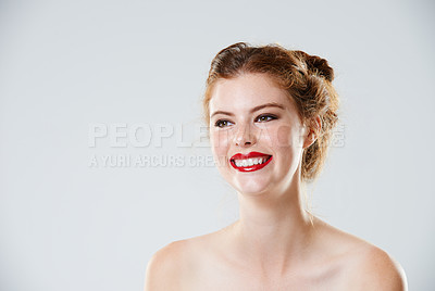 Buy stock photo Cropped studio shot of a beautiful young woman with bare shoulders isolated on gray