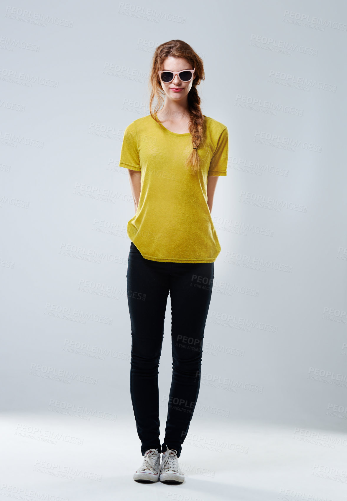 Buy stock photo Portrait, sunglasses and woman with trendy, fashion and shades on gray studio background. Face, person and model with funky eyewear, emoji and clothes with gen z, smile and aesthetic with confidence