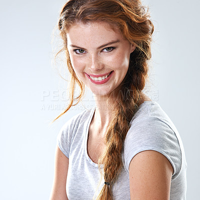 Buy stock photo Woman, face and happiness with portrait, natural makeup and casual aesthetic. Model, confident and freckles with smile, glow and cosmetics satisfaction with self care on white studio background