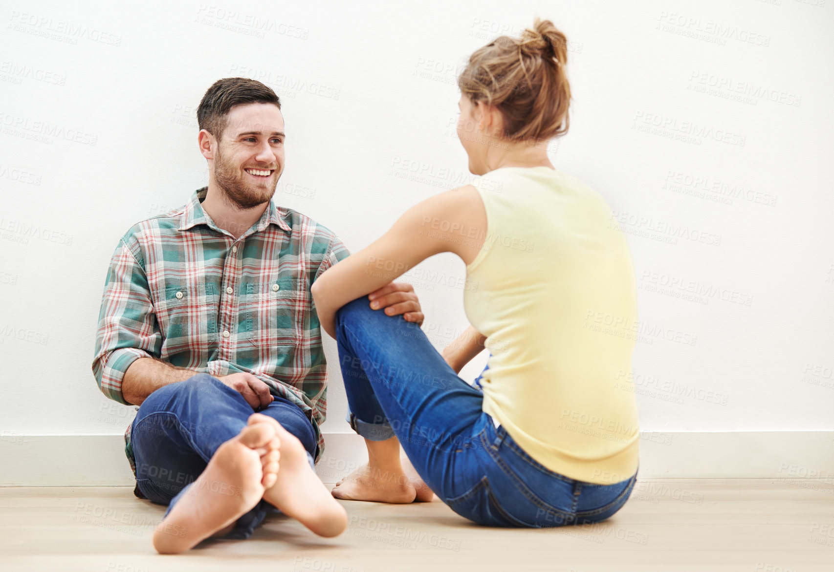 Buy stock photo Couple, happy and relax in house for talking, bonding and love together with romance on floor. Man, woman and smile in apartment for communication, relationship and chill on weekend with partner