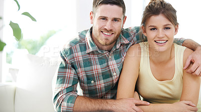 Buy stock photo Portrait, care and happy couple hug in home for love, connection and support for healthy relationship. Face, man and woman embrace for bonding together, commitment or relax on living room sofa in USA