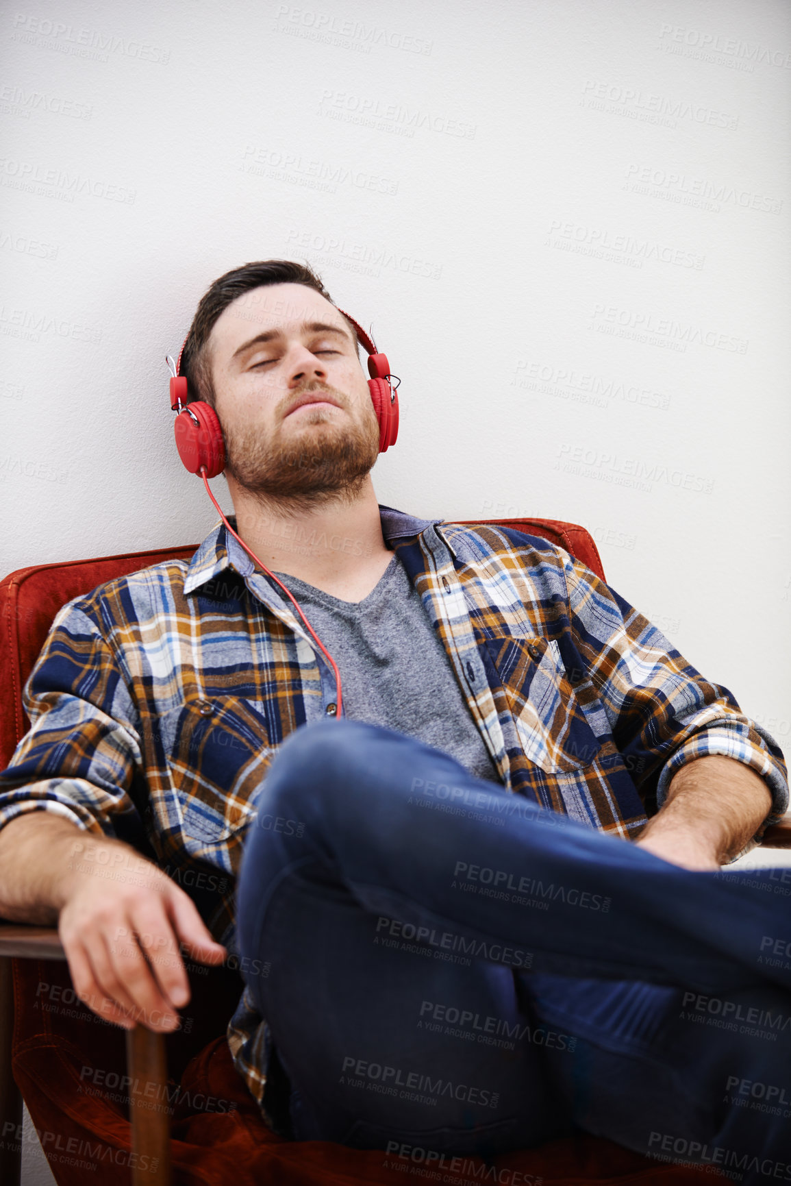 Buy stock photo Man, headphones and nap in living room with music, song or podcast to relax on the weekend at home. Audio, streaming and internet radio with calm track in chair with digital and online listening