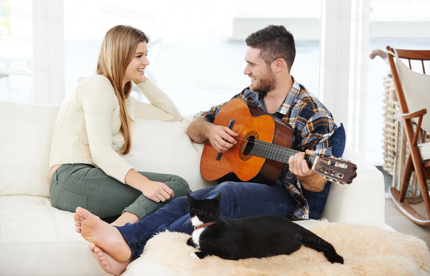 Buy stock photo Happy couple, home and playing guitar for bonding, together and relationship with love or support. Woman, man and music instrument for fun, rekax and comfort in lounge for session, peace or memory