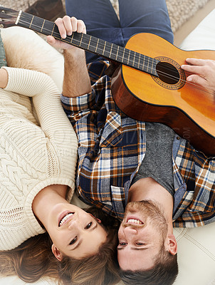 Buy stock photo Above, couple and happy on floor with guitar for music notes, bonding and love on break at home. People, relationship and smile or satisfied with instrument for romance, support and trust or care