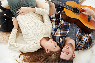 Buy stock photo Above, couple and smile on floor with guitar for music notes, bonding and love on break at home. People, relationship and happy or satisfied with instrument for romance, support and trust or care