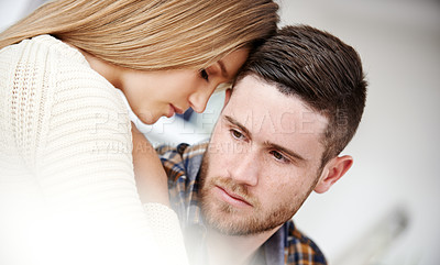 Buy stock photo Shot of a young couple sharing a quiet moment together