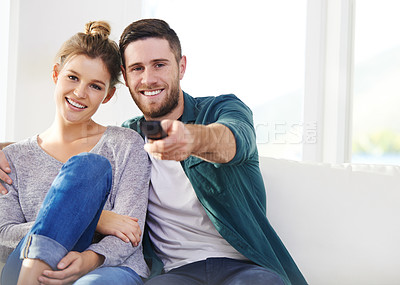 Buy stock photo Relax, portrait and happy couple watching tv in house for movie choice, streaming service and chill. Television, man and woman smile in living room for drama show, film and change channel on sofa