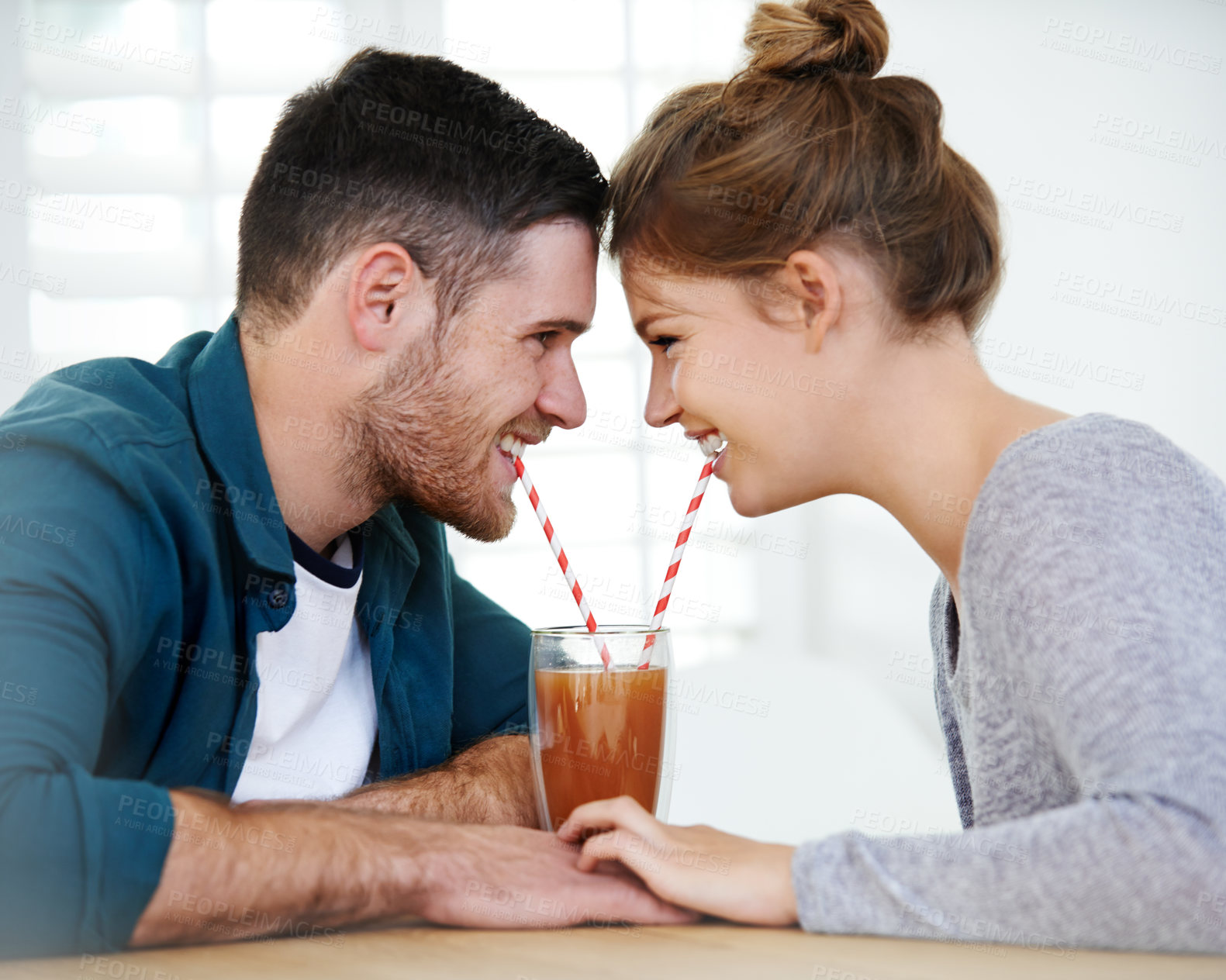 Buy stock photo Holding hands, milkshake and cafe with couple on date for romance, bonding and care. Smoothie, coffee shop and care with man and woman sharing drink at restaurant for summer, break and relationship