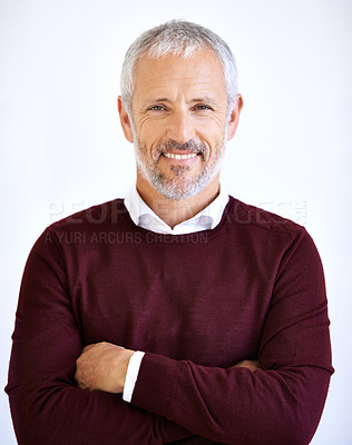 Buy stock photo Studio portrait of a handsome mature business standing against a white background