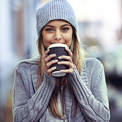 Buy stock photo Portrait of a beautful young woman drinking coffee while out in the city