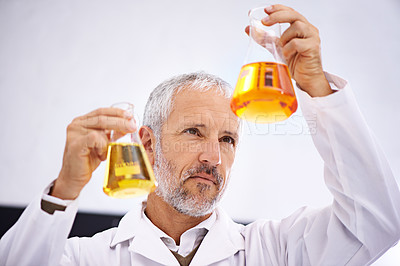 Buy stock photo Analysis, chemical and mature man in lab, scientist and medical research for drug development and cure. Healthcare, thinking and comparing of experiment, mpox and liquid for chemistry in clinic