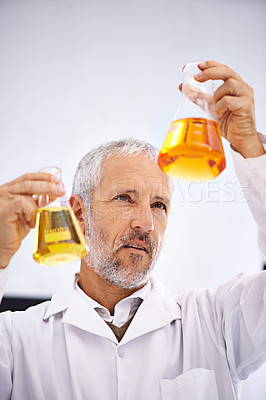 Buy stock photo Test, chemical and mature man in lab, scientist and medical research for drug development and cure. Healthcare, thinking and comparing of results, mpox and liquid for chemistry, analysis and clinic