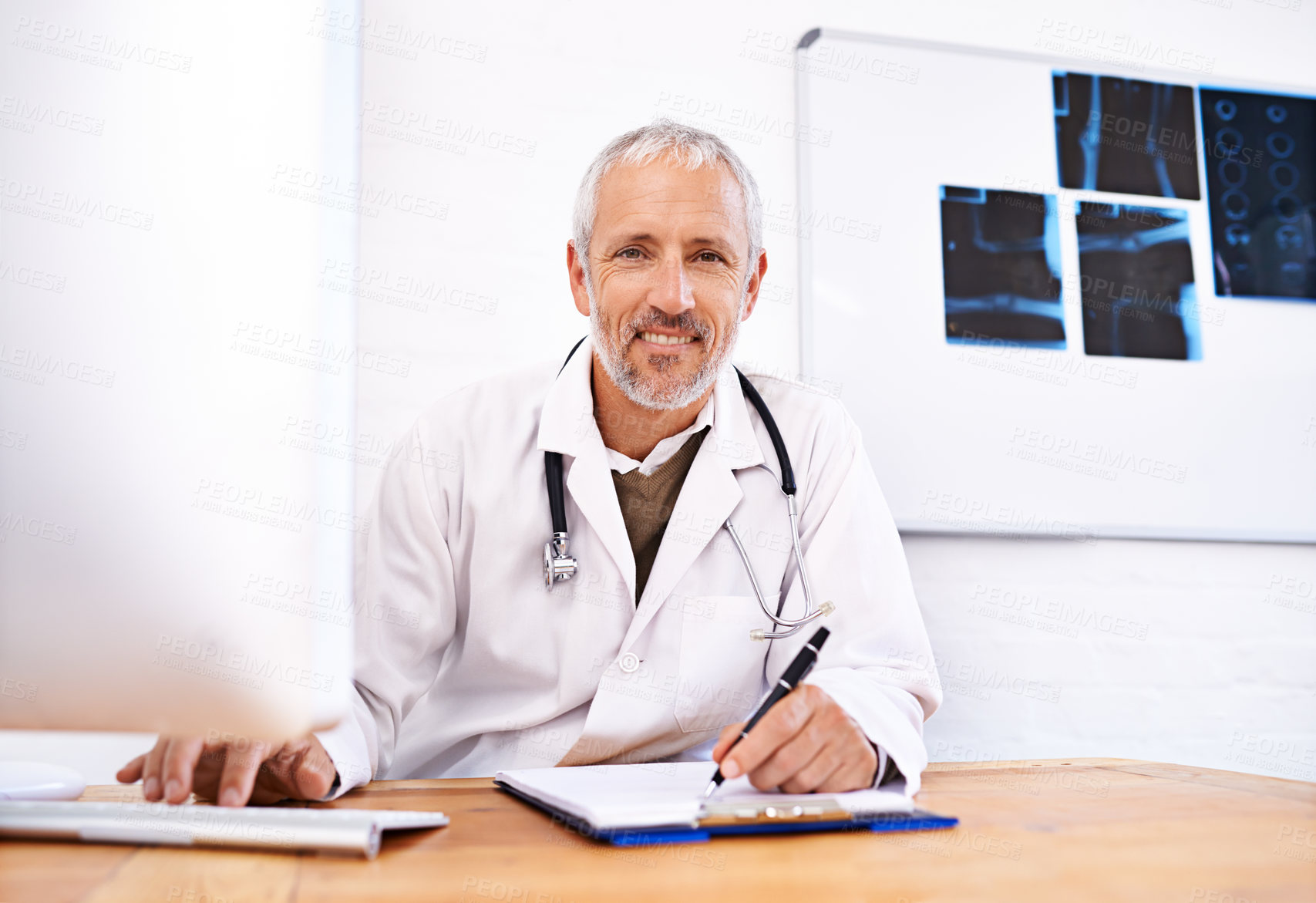 Buy stock photo Computer, radiology and healthcare with portrait of doctor in hospital for scan, medical or ai tumour detection. Smile, insurance and research with mature man and clipboard for mri disease screening