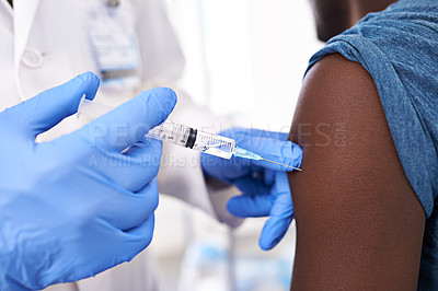 Buy stock photo Closeup shot of a male patient receiving an injection from a doctor