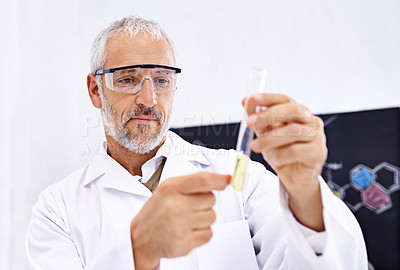 Buy stock photo Science, man and test tube in lab for experiment, chemical development and PPE for safety. Mature scientist, thinking and liquid in vial for observation, results or medicine engineering or innovation