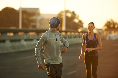 Buy stock photo Couple, fitness and running with partner on street in city for workout, training or outdoor exercise together. Man, woman or runners in cardio on asphalt or road for health or wellness in urban town