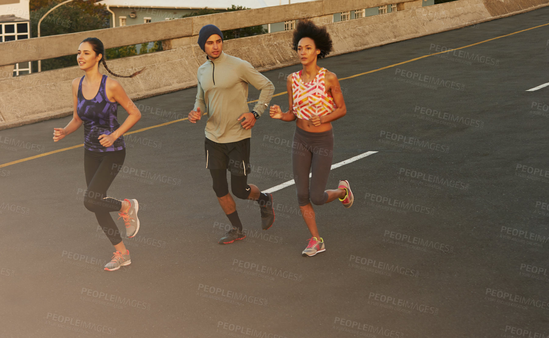 Buy stock photo Urban, workout and people on road running together for sports training, commitment and body health. Evening, city and group of friends on street for fitness, exercise or outdoor wellness challenge