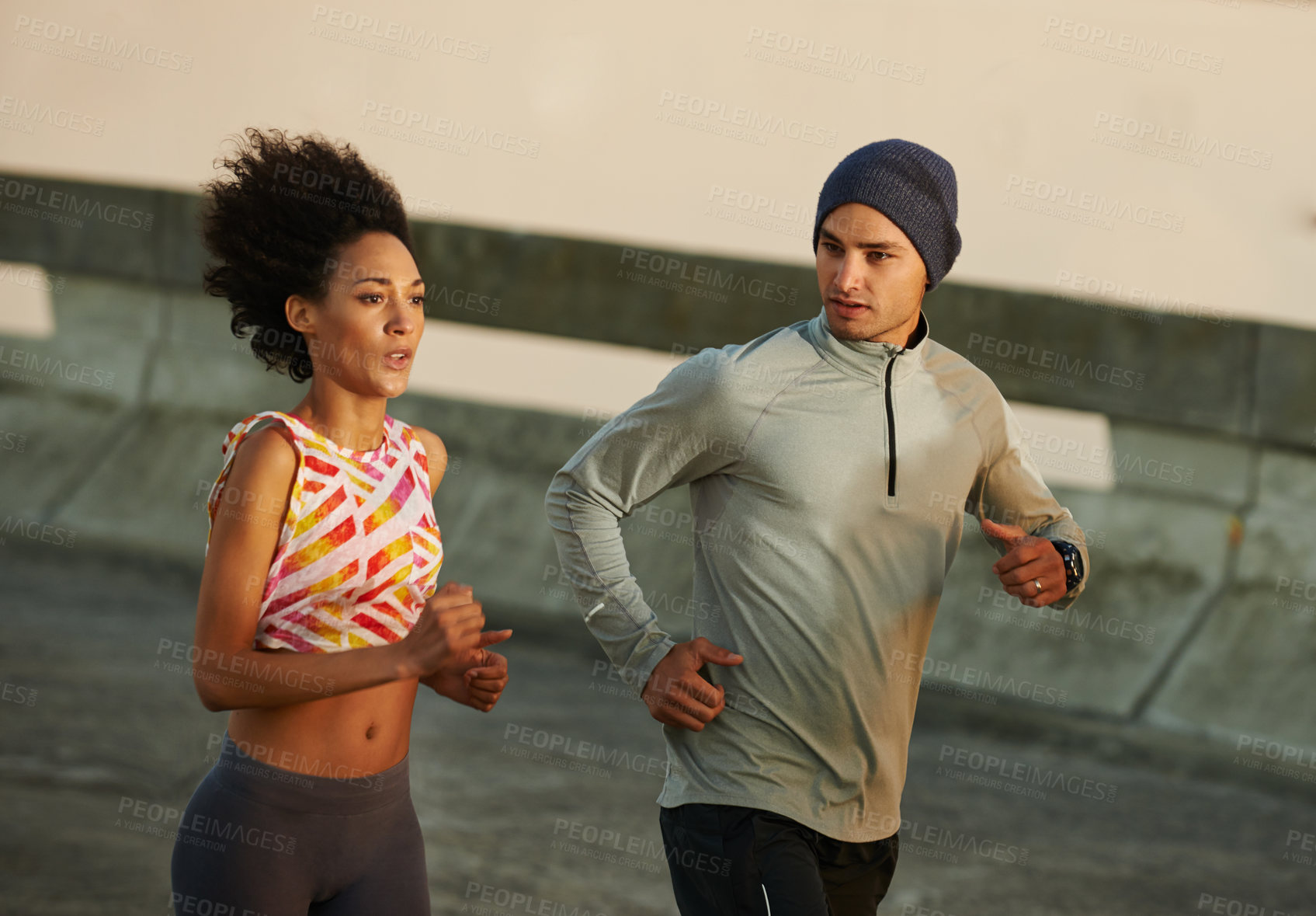 Buy stock photo Urban, workout and couple on street running together for sports training, commitment and body health. Evening, man and woman on road for fitness, exercise or outdoor wellness challenge on bridge