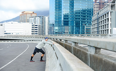Buy stock photo Man, portrait and warm up for fitness in city, bridge challenge and morning for cardio workout. Male person, stretching and urban town for muscle relief, outdoor and athlete for start of training